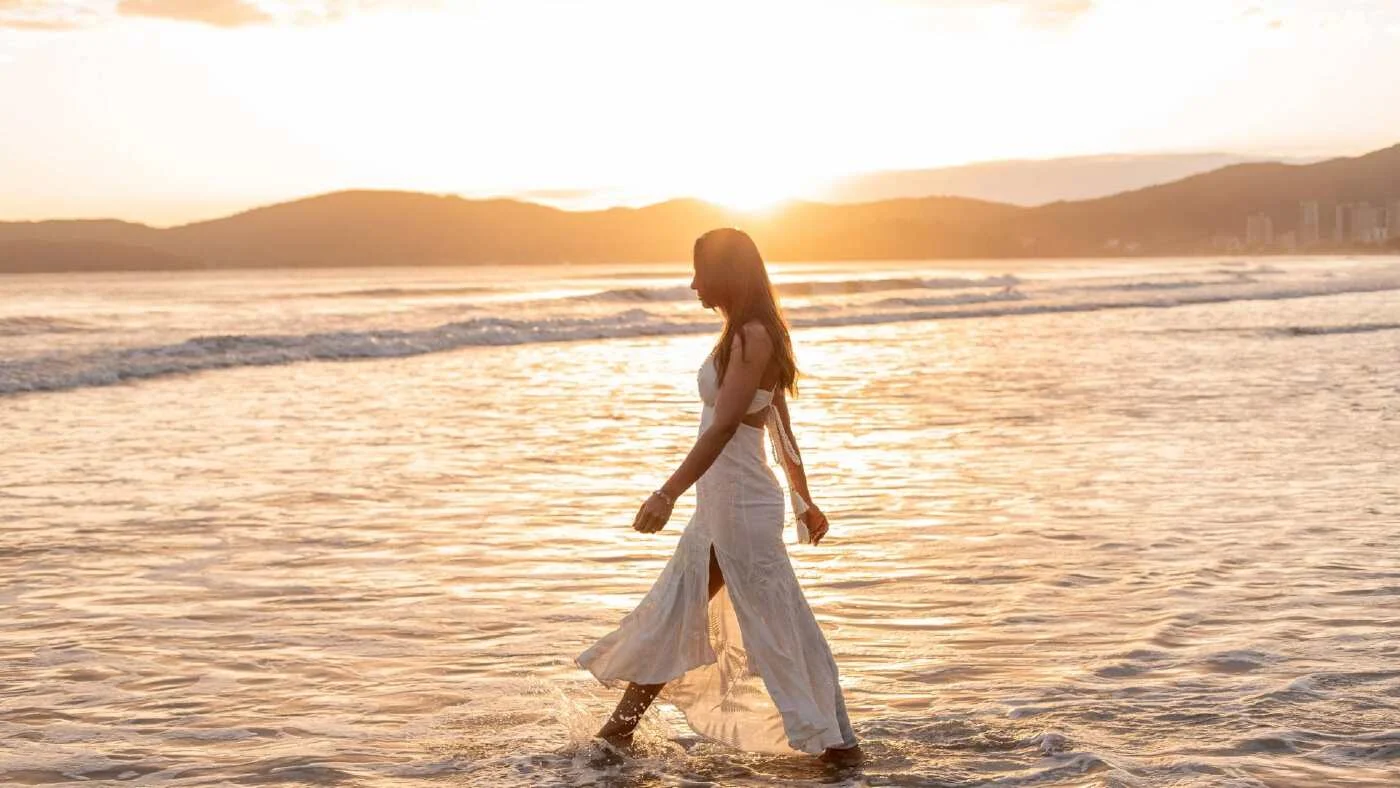 girl-walking-at-beach-during-sunset